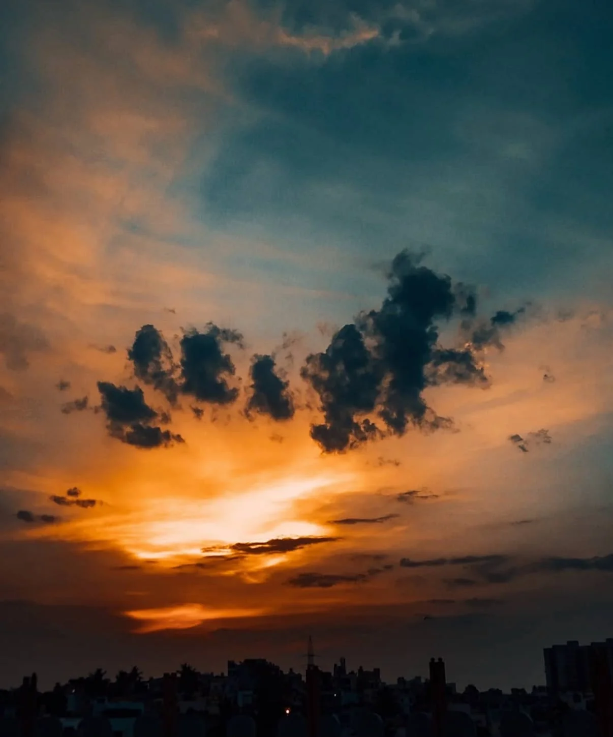 A sunset over the city skyline, photographed by Suhail